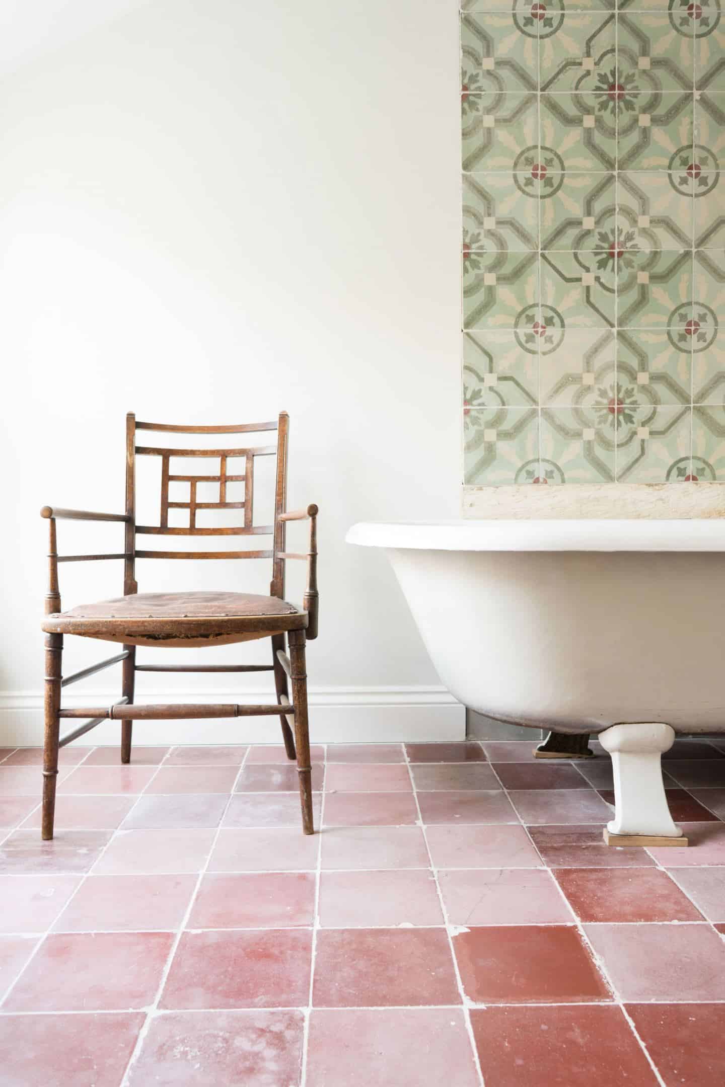 Reclaimed or antique tiles on a bathroom wall and floor - Maitland & Poate