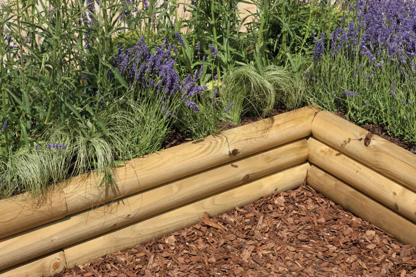 Flower beds behind half sleepers