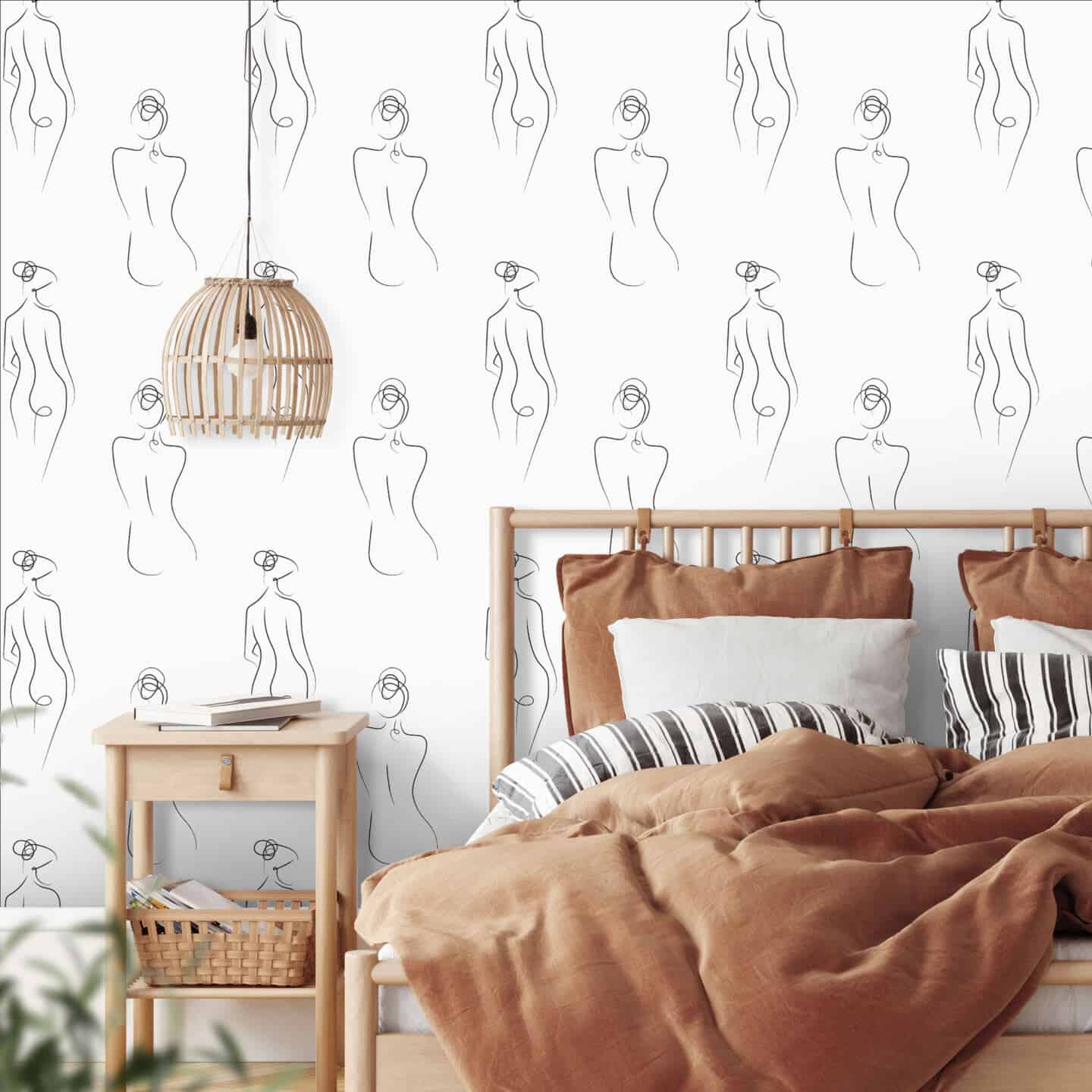 White wallpaper in a bedroom featuring abstract line drawings of the female form