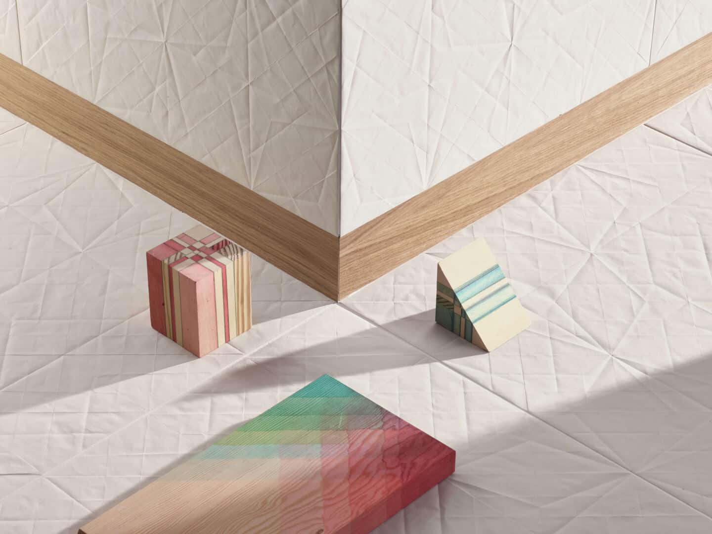 White textured tiles on the floor and walls. The pattern looks like folded paper.
