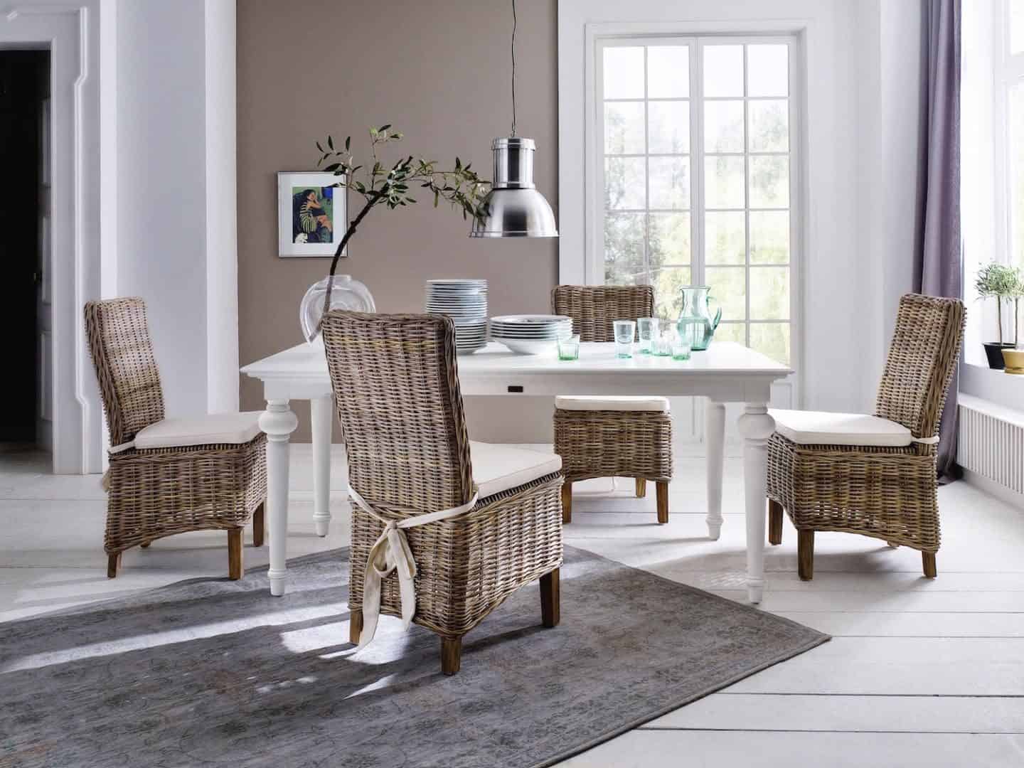 New Nordic interior featuring white floor boards, rattan furniture and neutral walls. Furniture from the Provence range from Novasolo