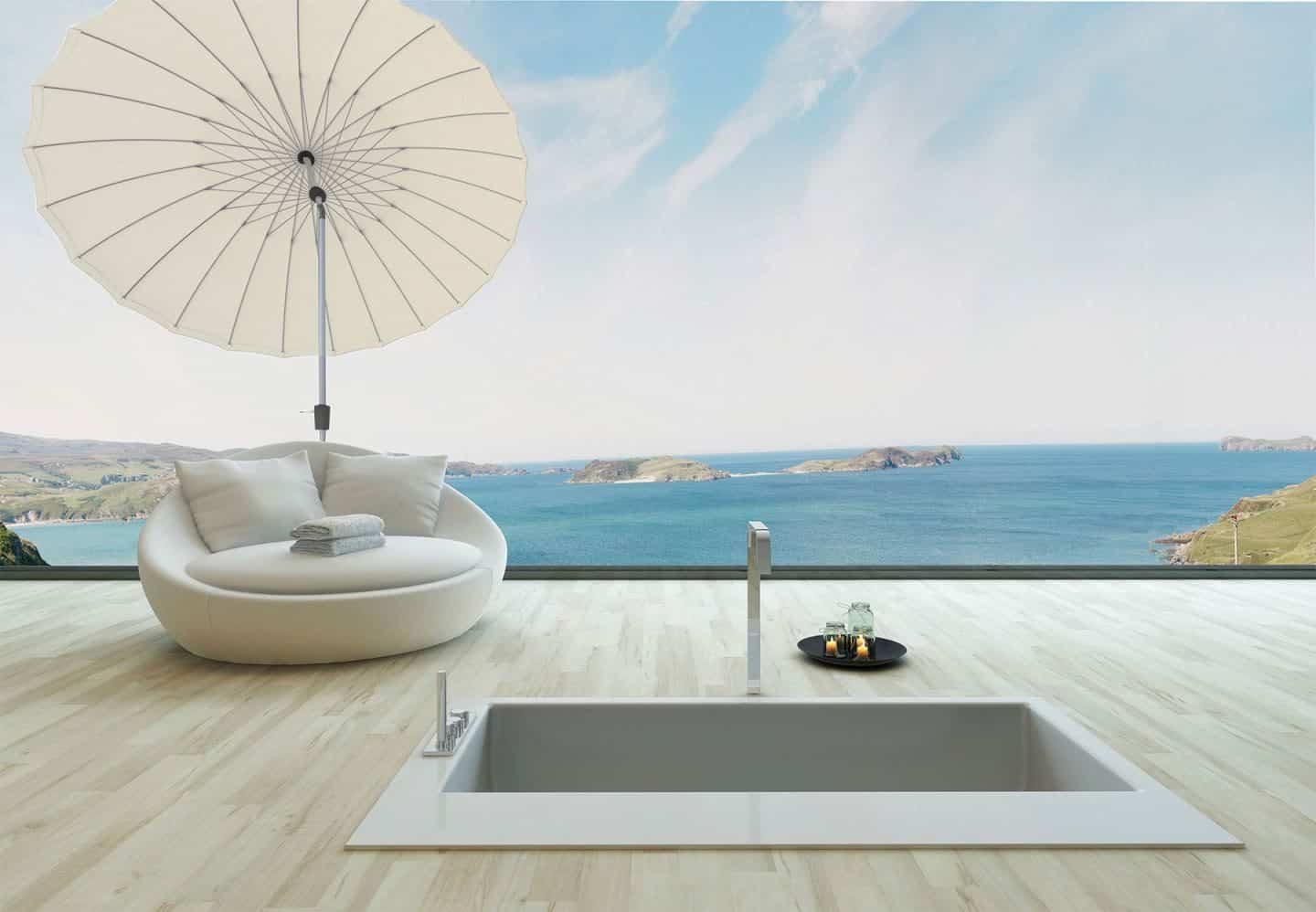 Garden Parasol from Solero Parasols. Large round white garden parasol angled above an outdoor loungen chair