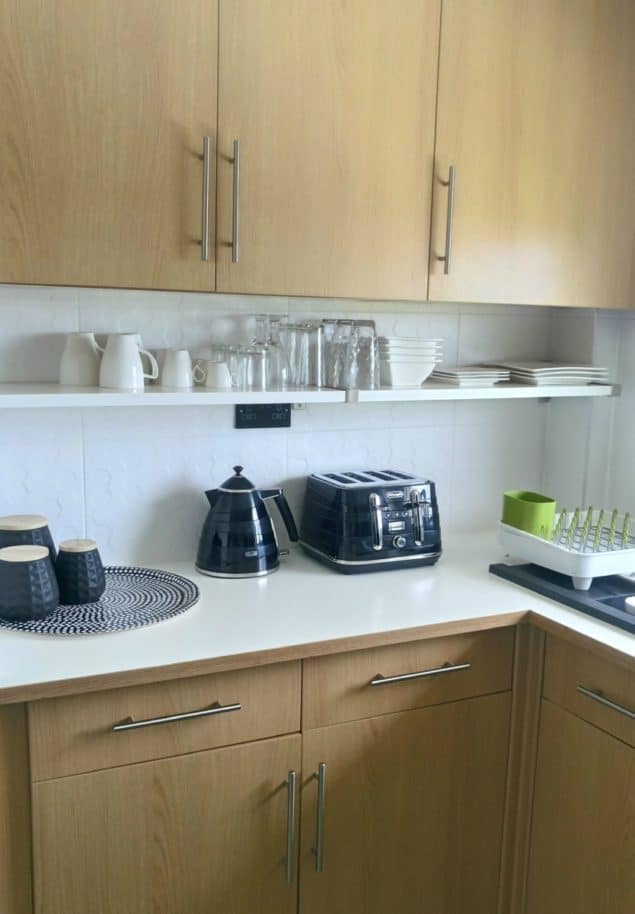 The Design Sheppard Kitchen Makeover featuring black kitchen accessories and open