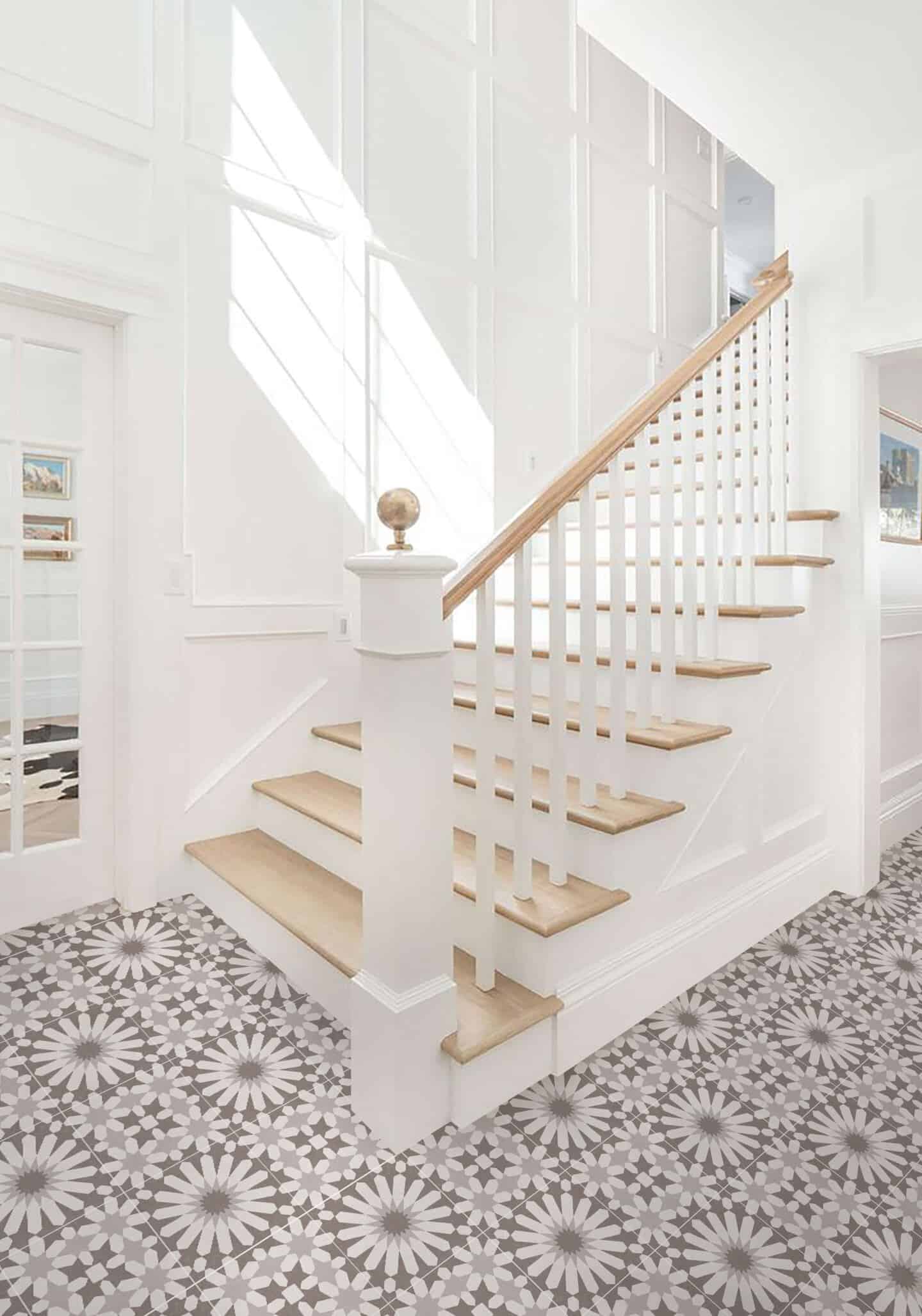 White wood panelled wall runs up beside the staircase
