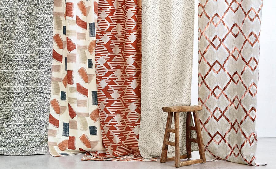 Huari fabric by Villa Nova hanging in panels with a wooden stook in front