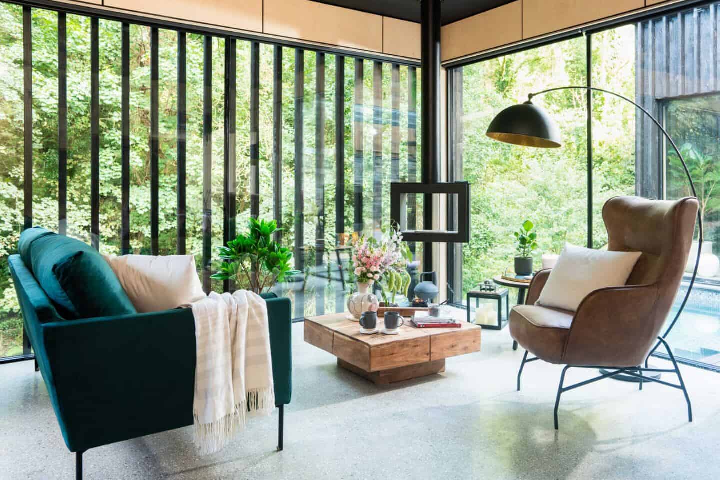 A sofa, arm chair and coffee table in the open plan living area at the Wildwood Spa in North Devon which has been furnished and styled by Wayfair.